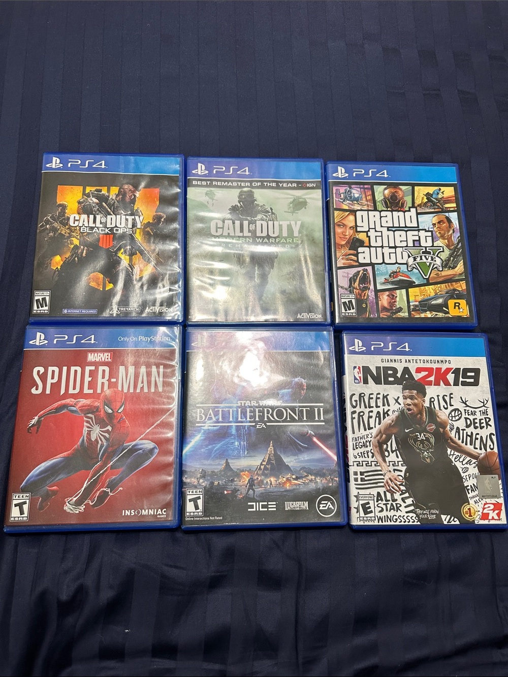 Sony PS4 Game Bundle with Blue Cases - Multiple Titles